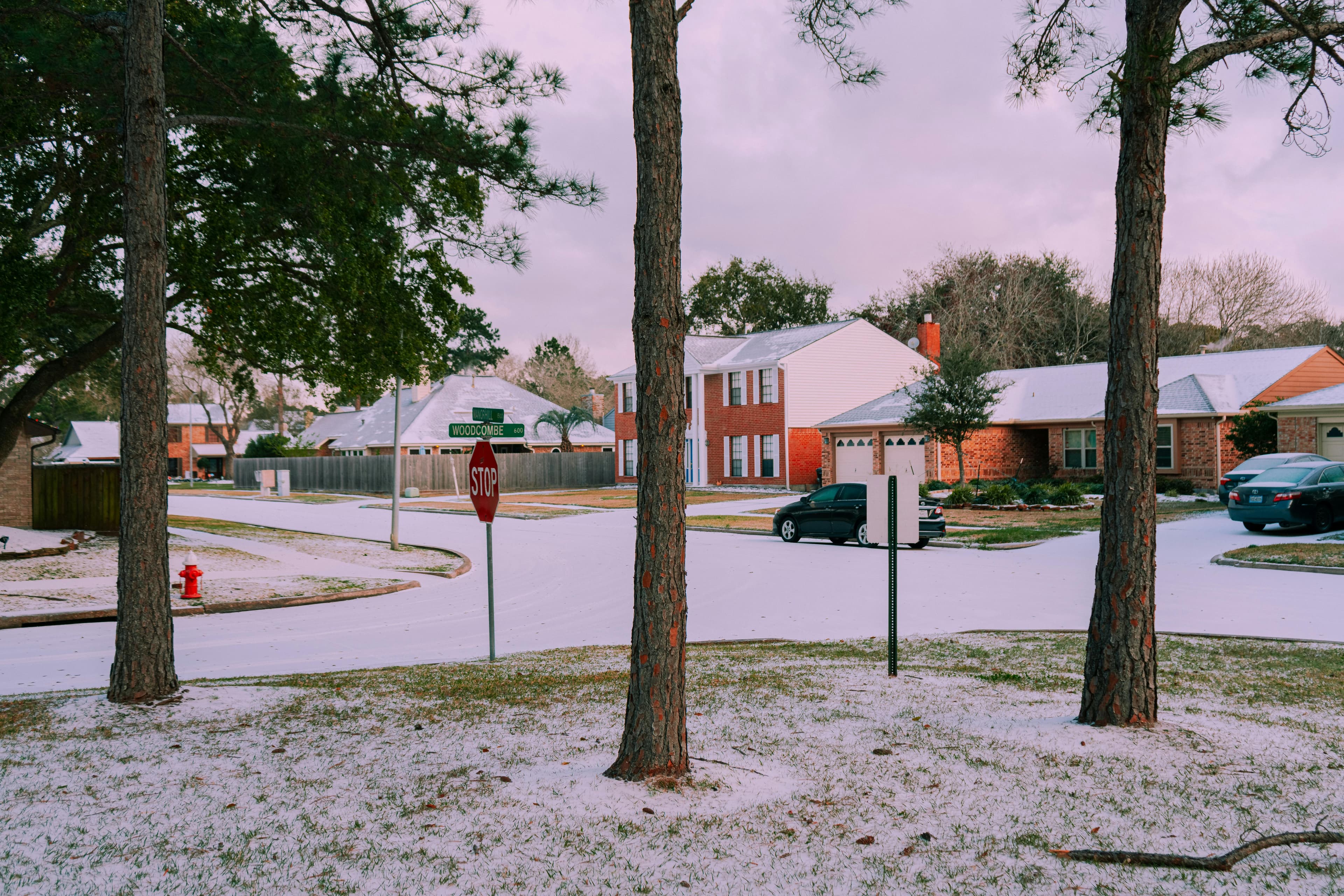 Snowy residential neighborhood representing winter furnace reliability
